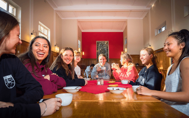 Students dining together and talking in our Dining Hall